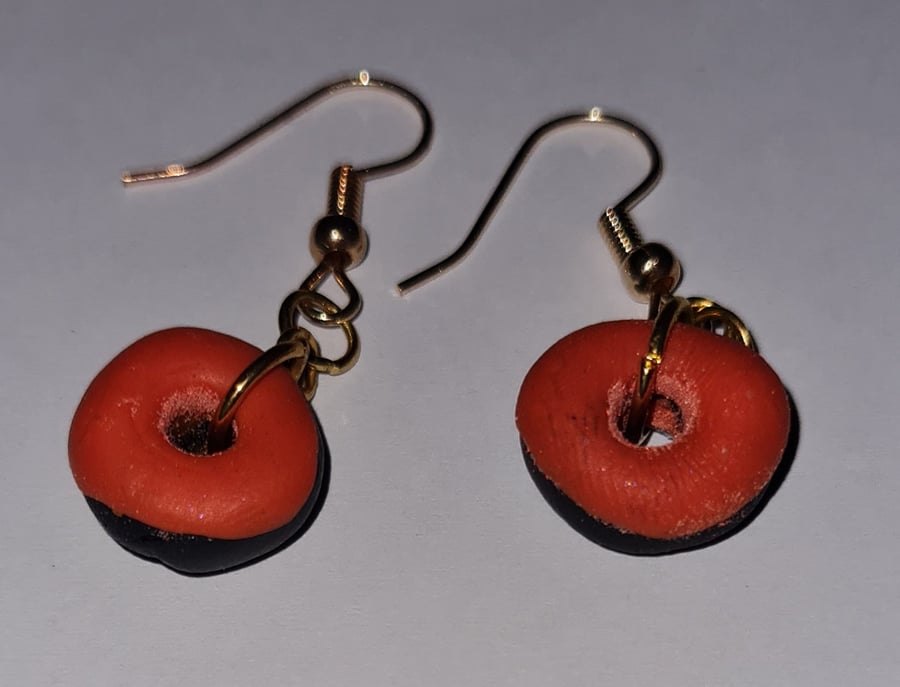 Black and orange doughnuts.