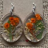 Oval-Shaped Resin Earrings With Peach and White Pressed Flowers