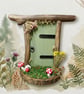 Handcrafted driftwood fairy door.