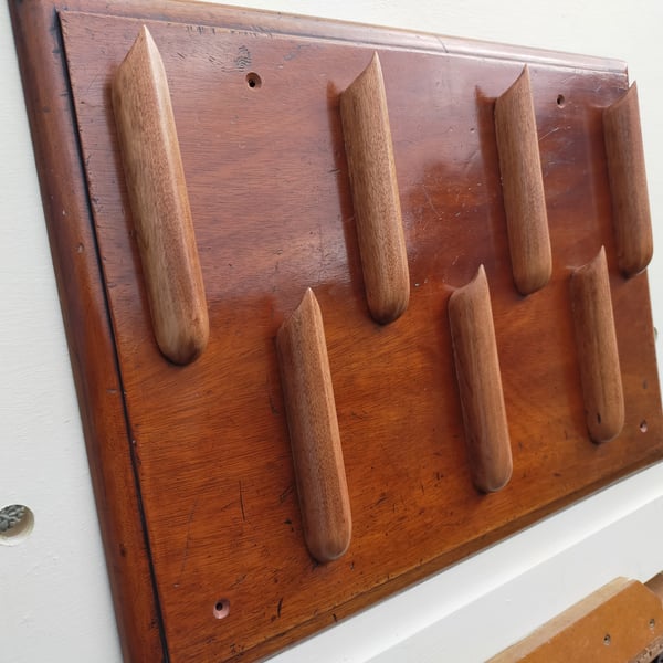 Unique "organ pipe" coat rack.