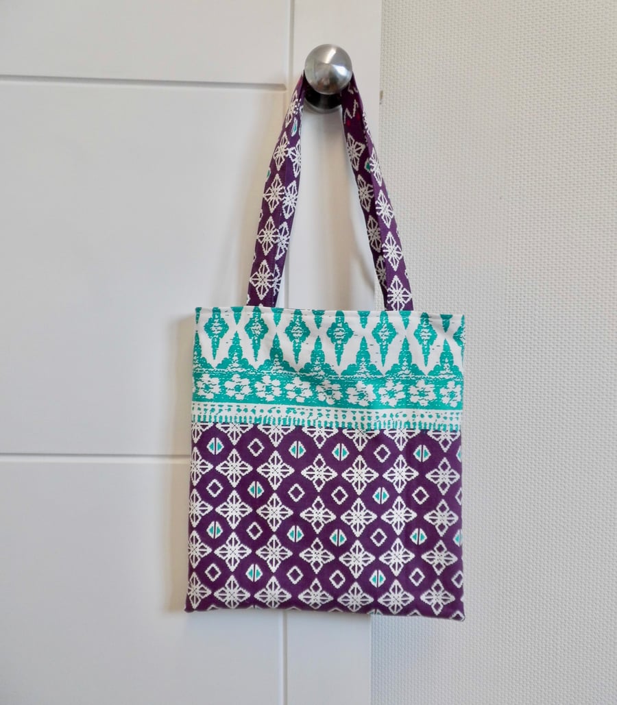 Tote bag in purple and green fabric