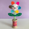 Embroidered Happy Flower in Wooden Bobbin- pale pink face with rose pink bobbin