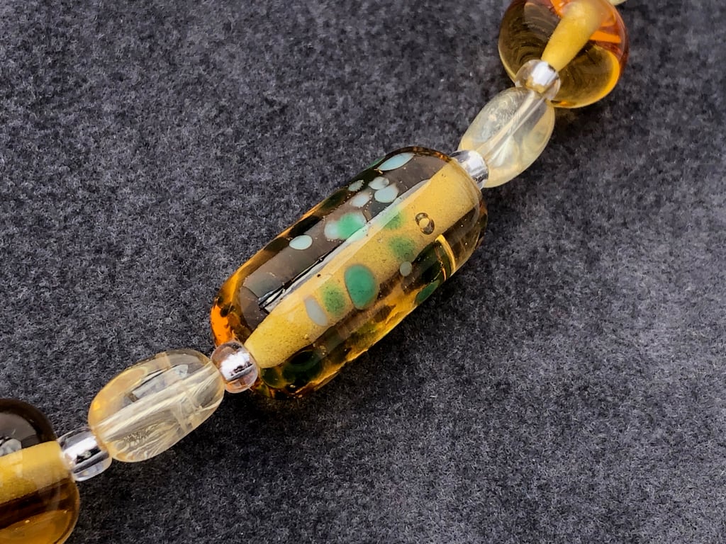 amber and green coloured lampwork glass beaded necklace with citrine stones