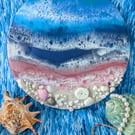 Beach with blue and pink sea