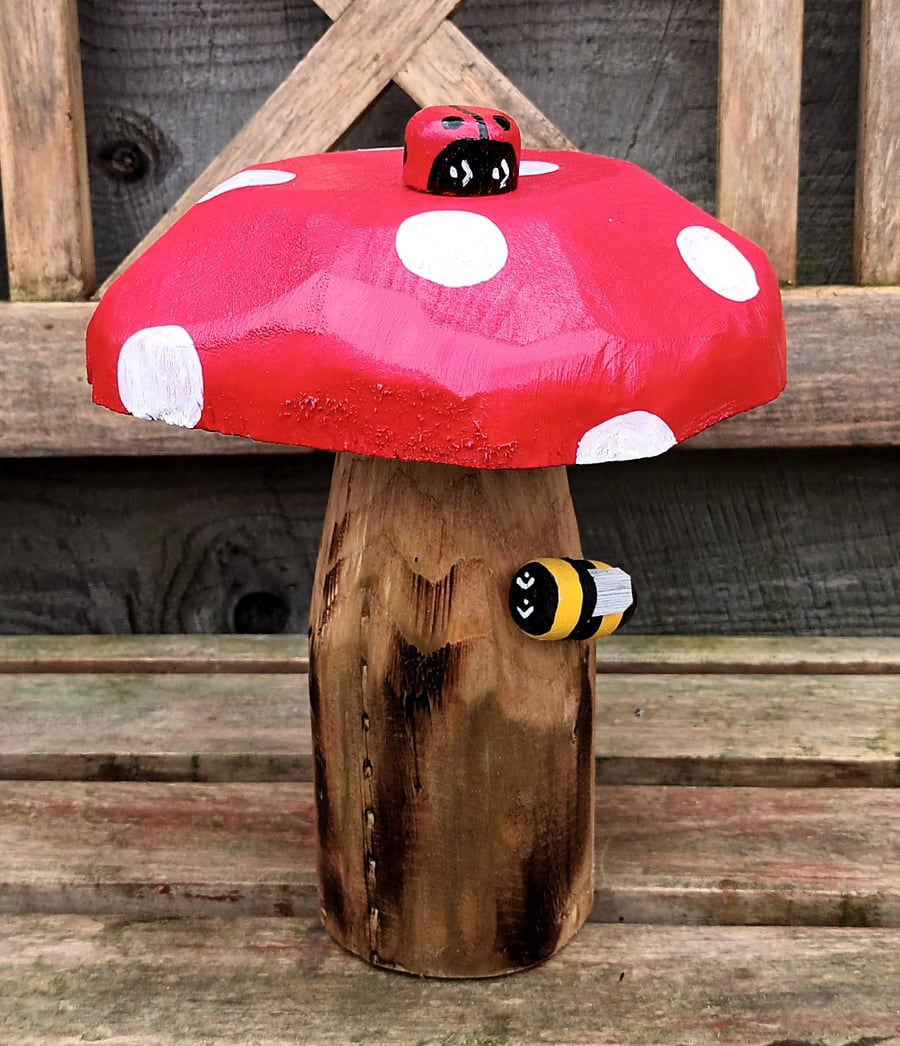 Toadstool with ladybird and bee