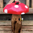 Toadstool with ladybird and bee