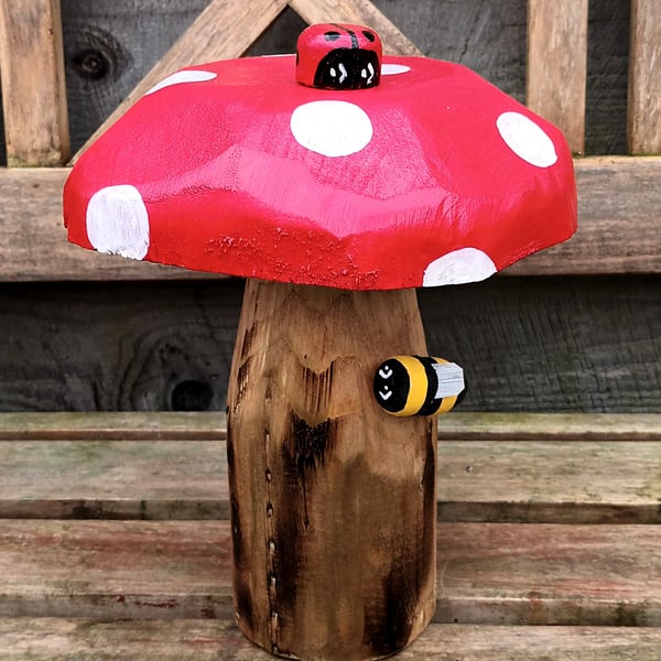 Toadstool with ladybird and bee