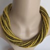 The Twist: felted cord necklace in shades of yellow