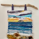 Sunset over the sea a textile seascape hanging