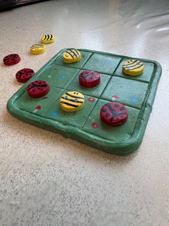 Handmade clay tik tak toe board and pieces bee and ladybug themed game