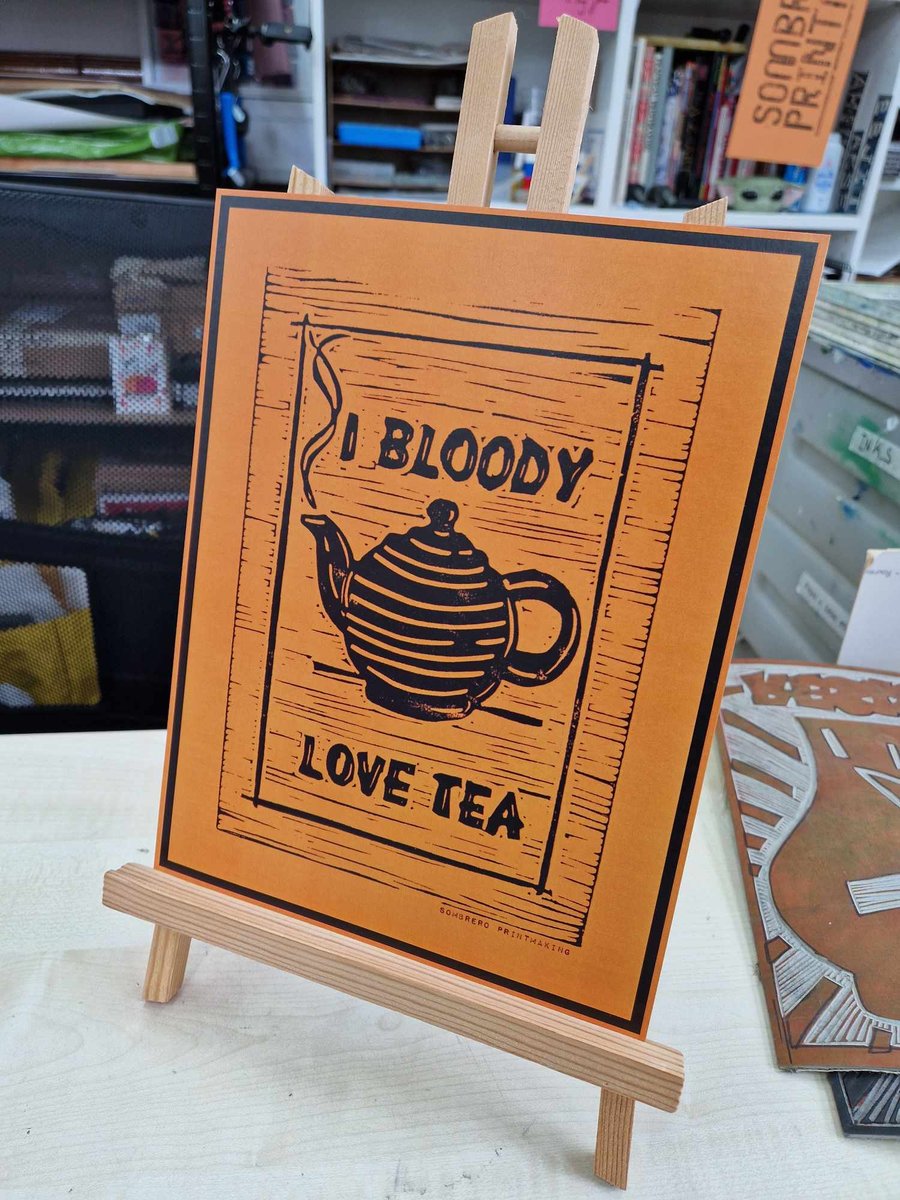 I bloody love tea. Orange and black print. 27.5cm X 21cm.