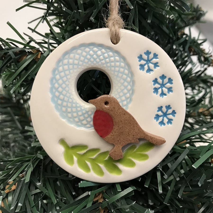 Ceramic Christmas decoration with robin on a branch
