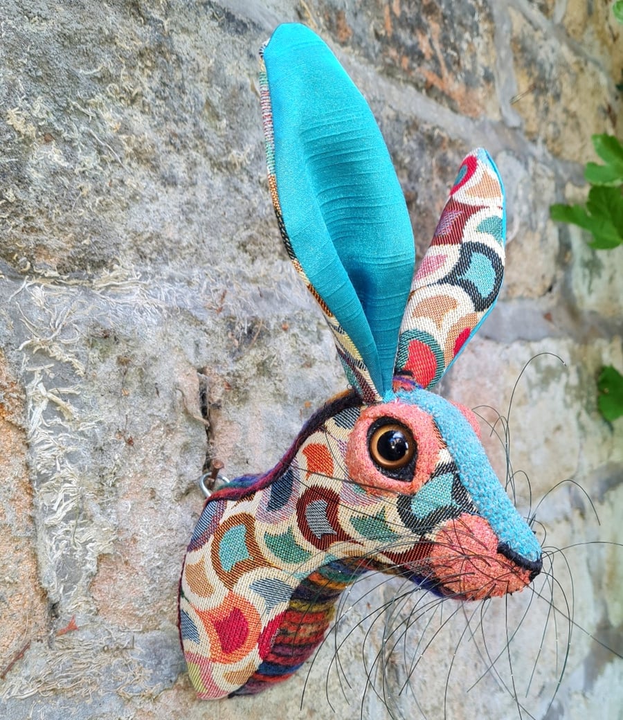 Faux hare head wall mount in turquoise and multi coloured circus style fabric