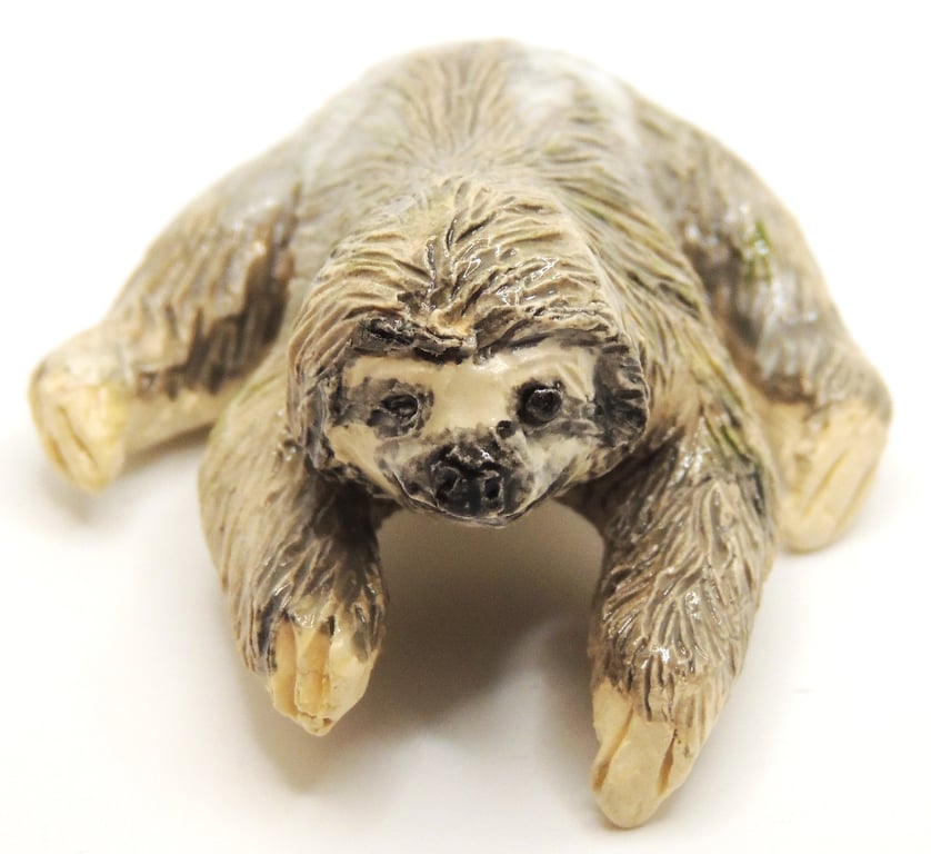 Miniature ceramic sloth sculpture 