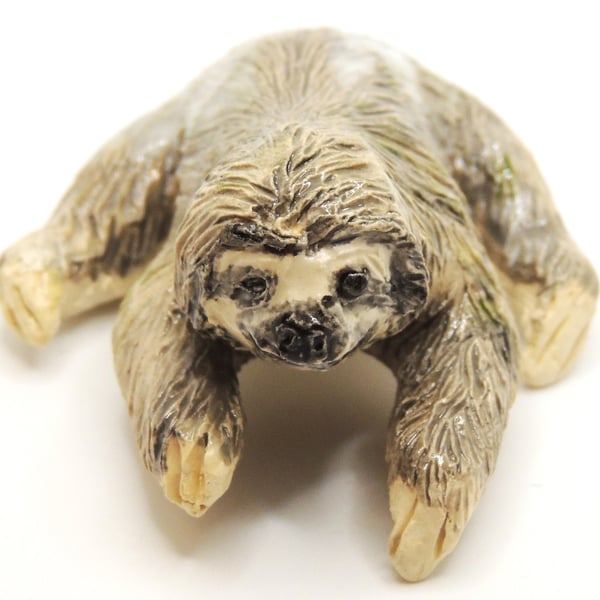 Miniature ceramic sloth sculpture 