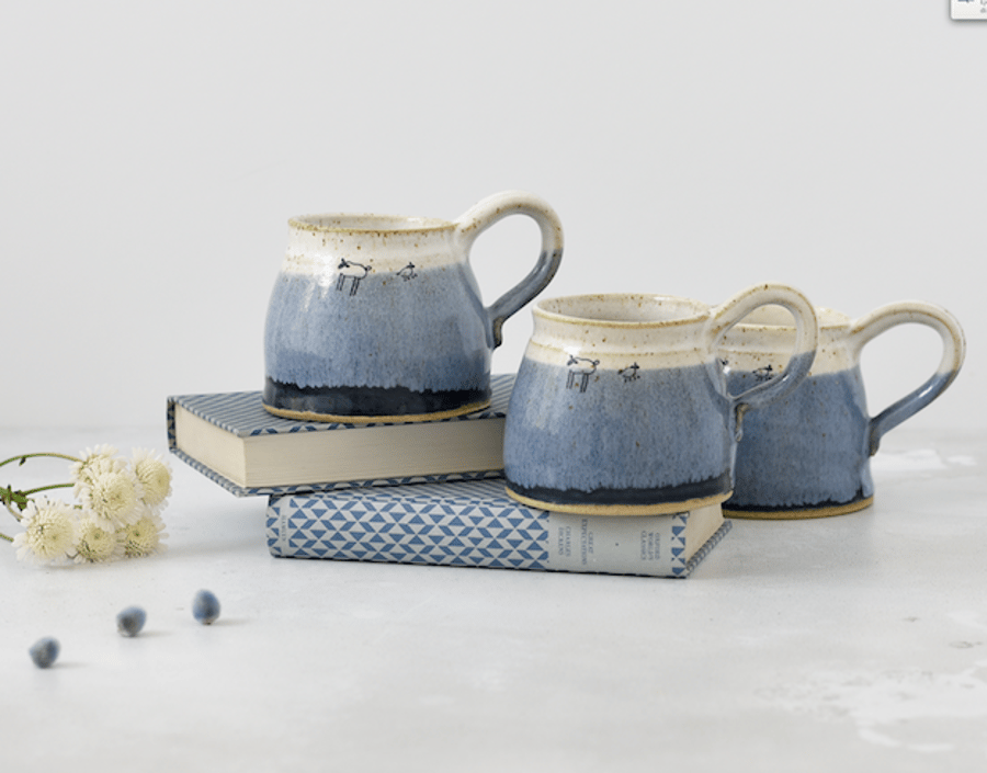 Handmade ceramic blue and white mug with lambs sheep - stoneware pottery