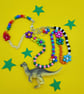 Chunky beaded necklace with up-cycled dinosaur charm