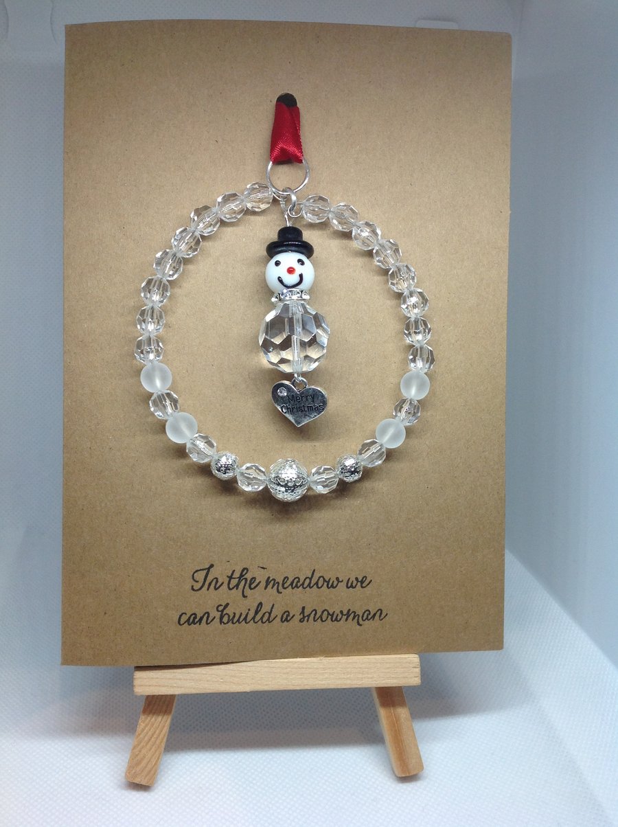 Handmade Glass bead snowman suncatcher, attached to a card.