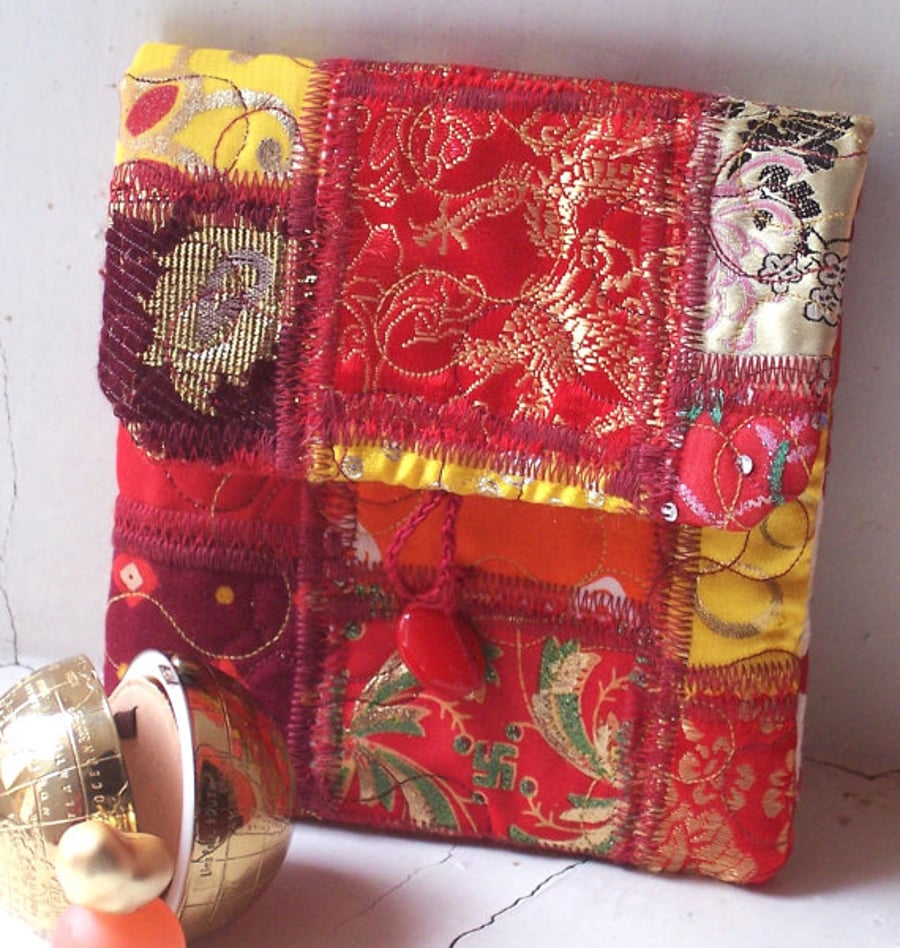 Asia - small textile art fabric clutch bag in orange, red and yellow
