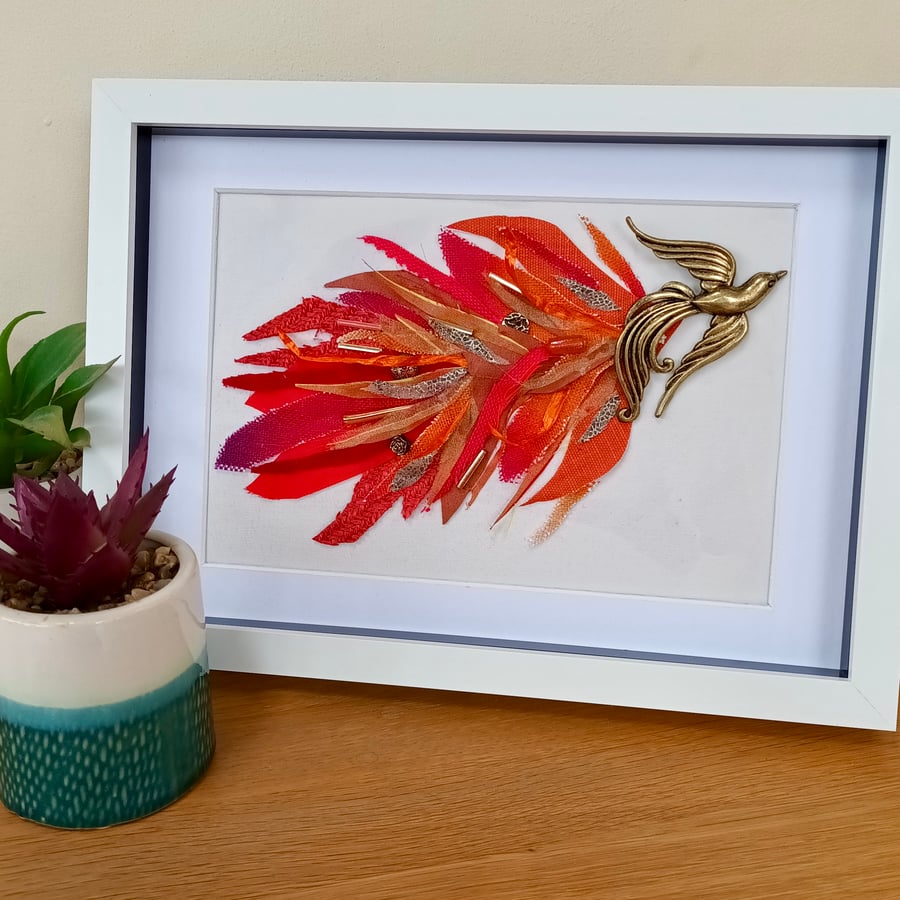 Phoenix from the flames bright bird collage made with recycled materials  A4