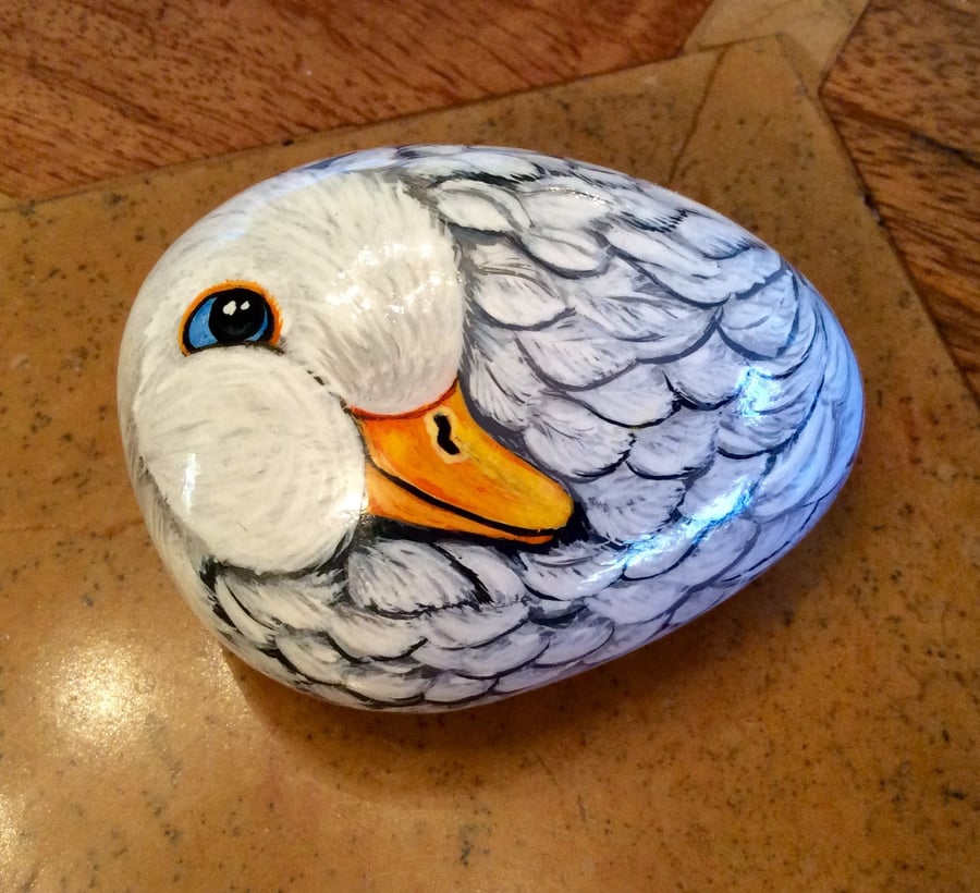 Duck hand painted on small stone cobble rock 