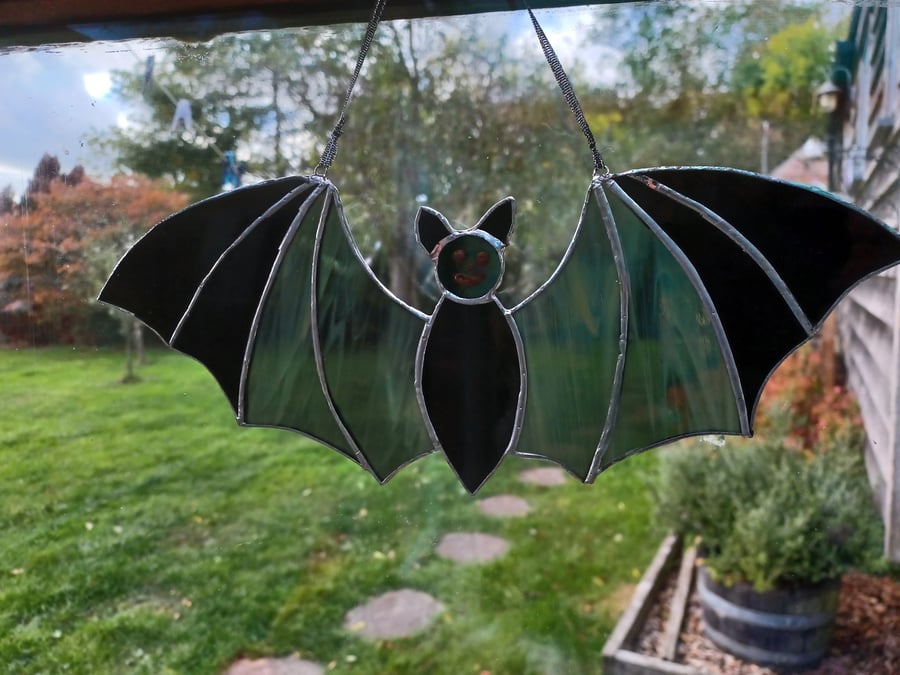 Stained glass halloween flying bat