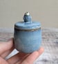 Small handmade ceramic lidded pot with baby penguin, blue glaze - Image 1