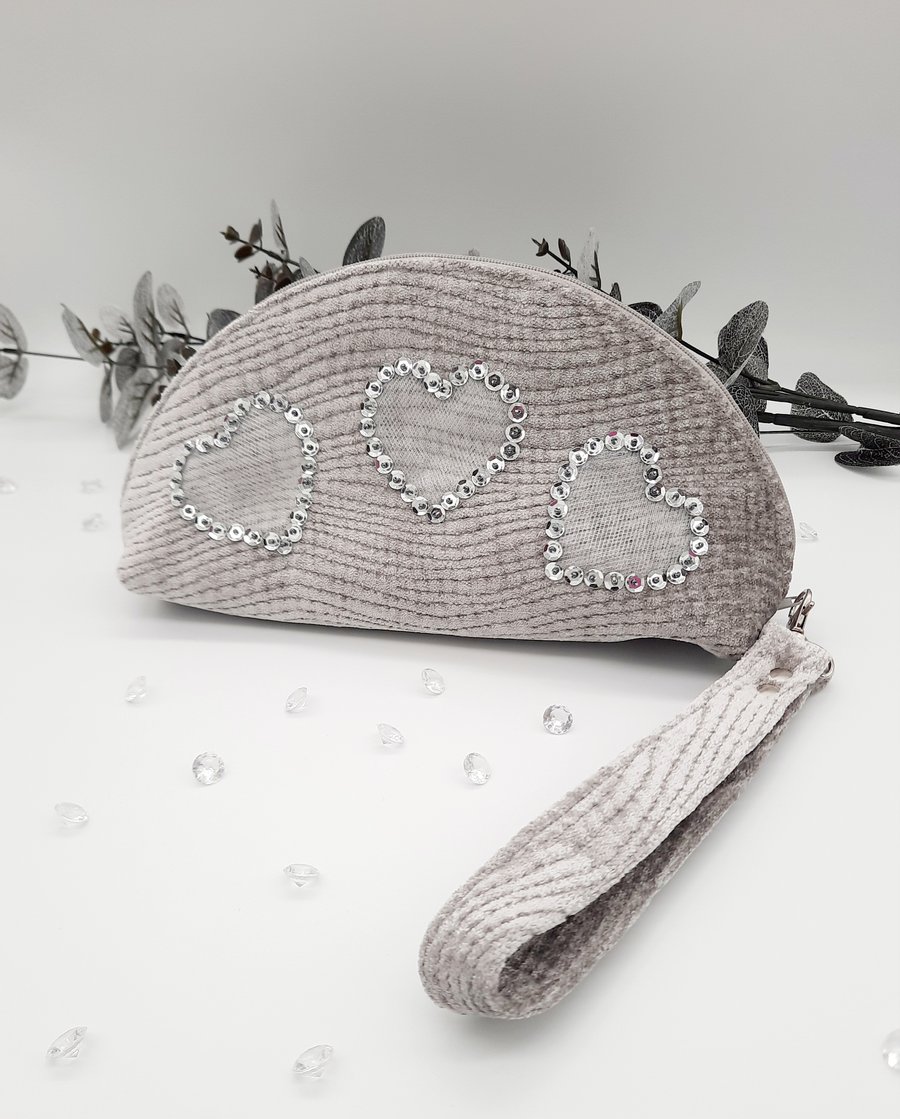 Silver chenille clutch bag with hearts and wristlet.  