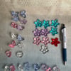Mixed lot of flower, star, heart and butterfly beads