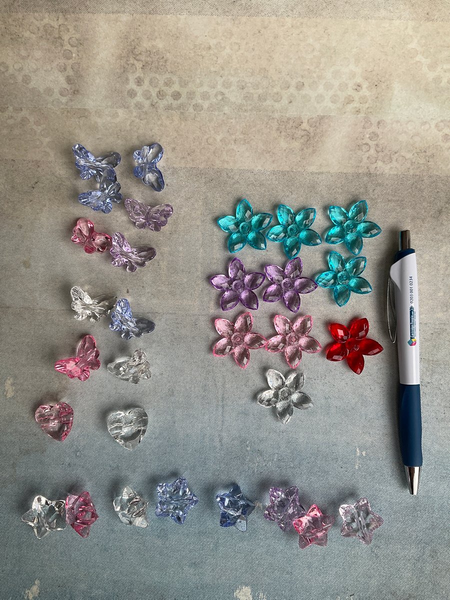 Mixed lot of flower, star, heart and butterfly beads