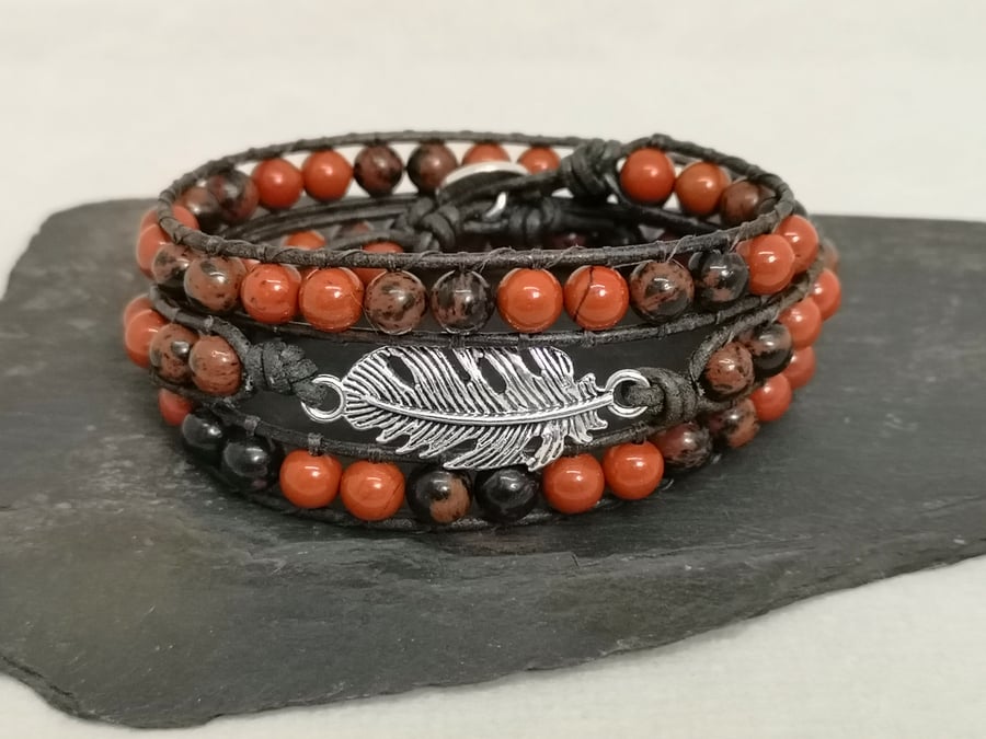 Red jasper and obsidian leather wrap bracelet with feather connector 