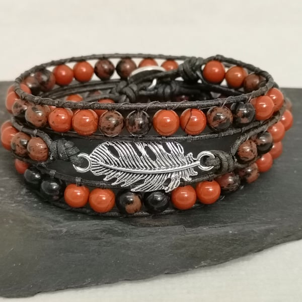 Red jasper and obsidian leather wrap bracelet with feather connector 