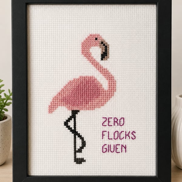 Framed flamingo picture in cross stitch