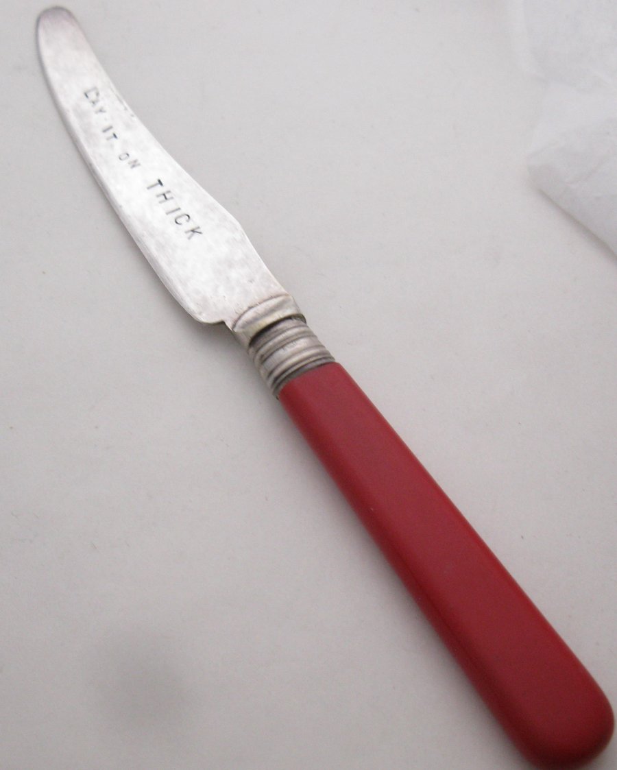 Lay it on thick, vintage spreader, red handle, handstamped