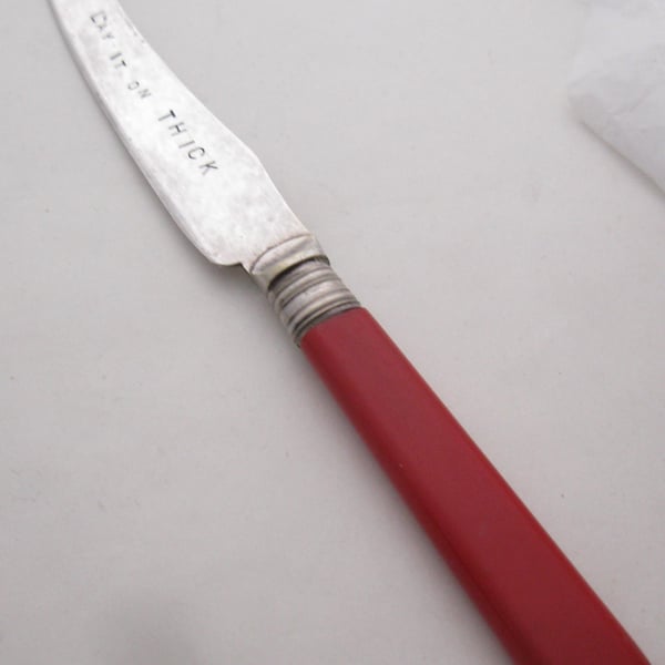 Lay it on thick, vintage spreader, red handle, handstamped