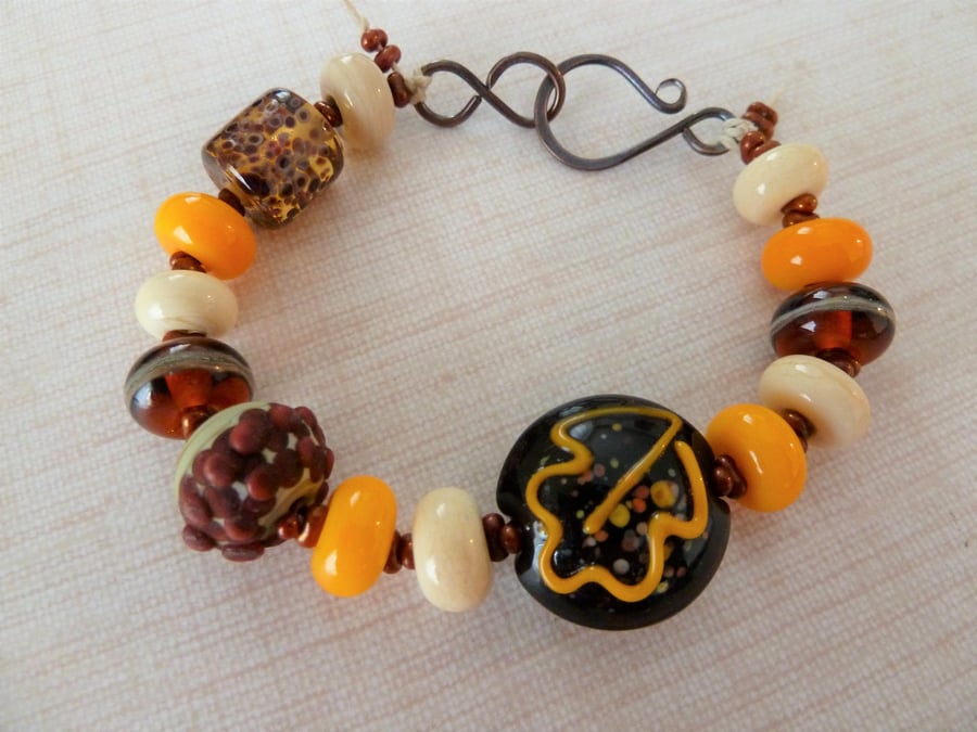 autumn leaves lampwork glass and copper bracelet