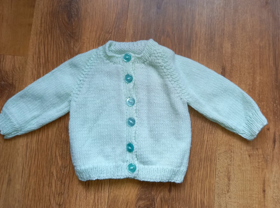 Hand knitted baby girls cardigan with sparkle