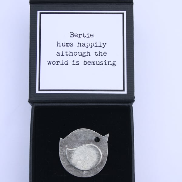 Bertie hums happily although the world is bemusing