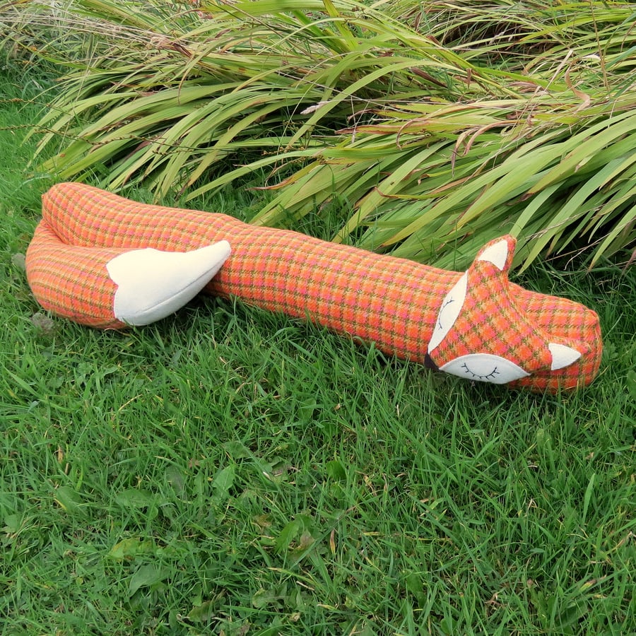 Long fox.  A snoozy fox draught excluder, made from tactile wool.