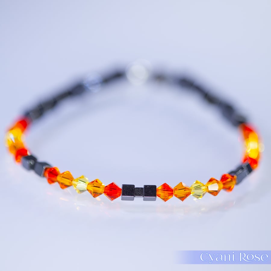 Bracelet handmade with Swarovski and Hematite beads stretchy black and orange