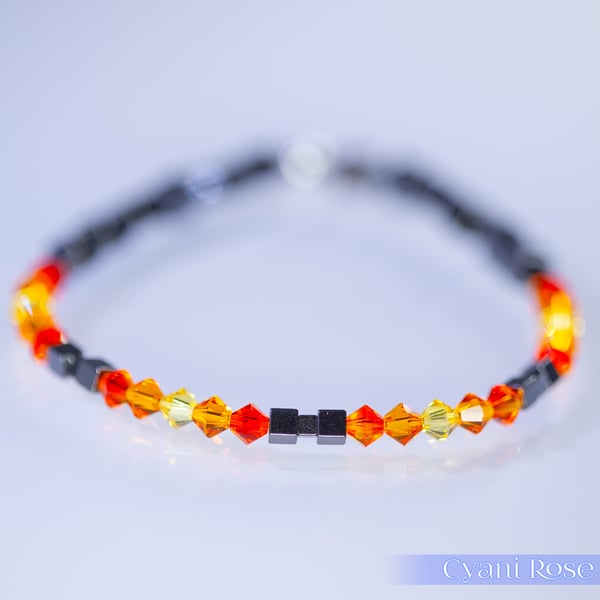 Bracelet handmade with Swarovski and Hematite beads stretchy black and orange