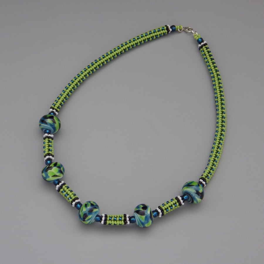 Bright green and blue beadwoven necklace with swirled UK lampwork beads