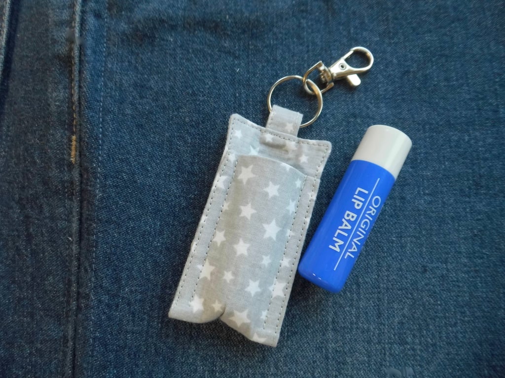 Key ring lip balm holder in grey and white star print fabric