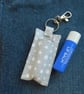 Key ring lip balm holder in grey and white star print fabric