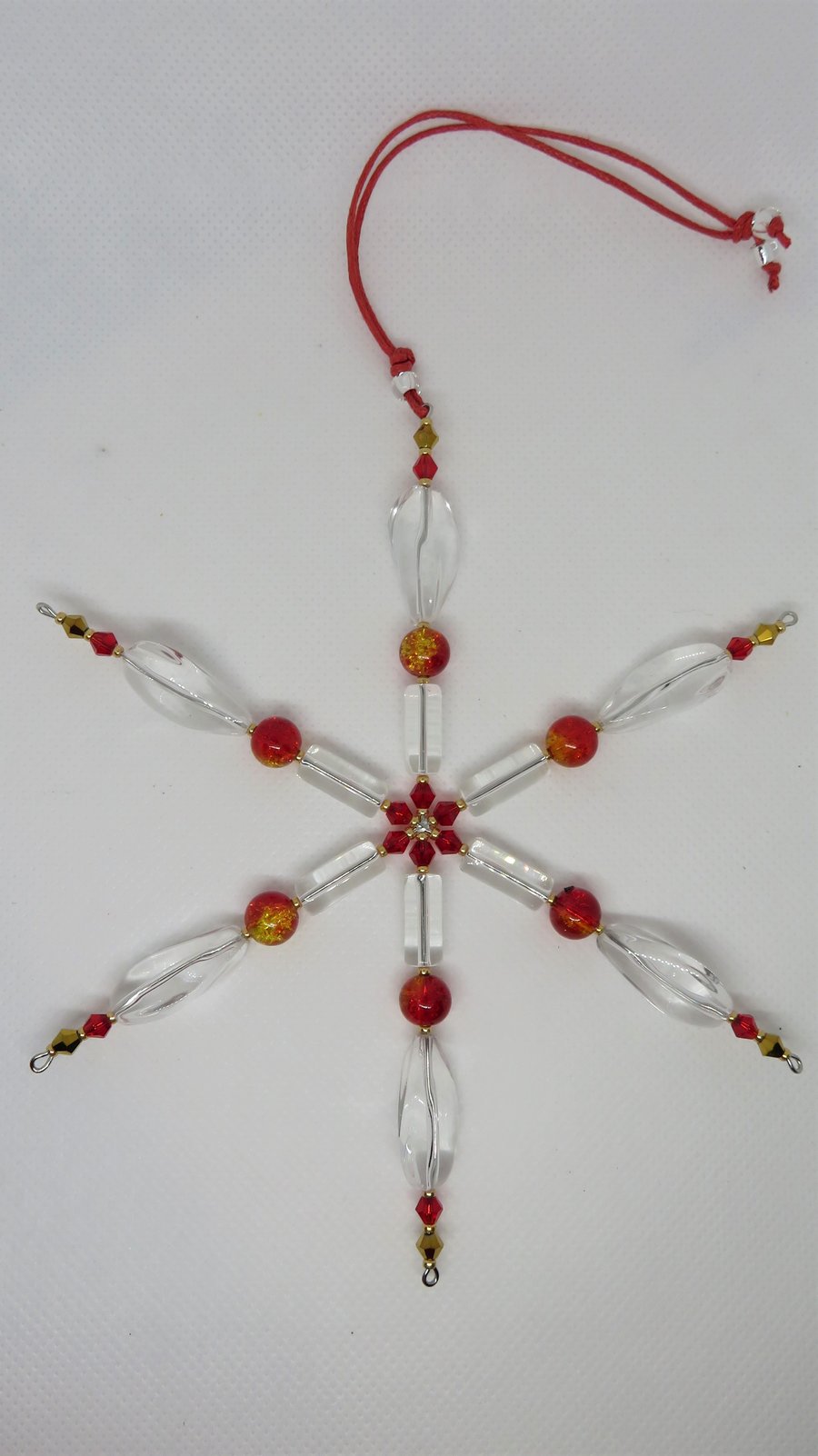 Large crystal and red snowflake or suncatcher