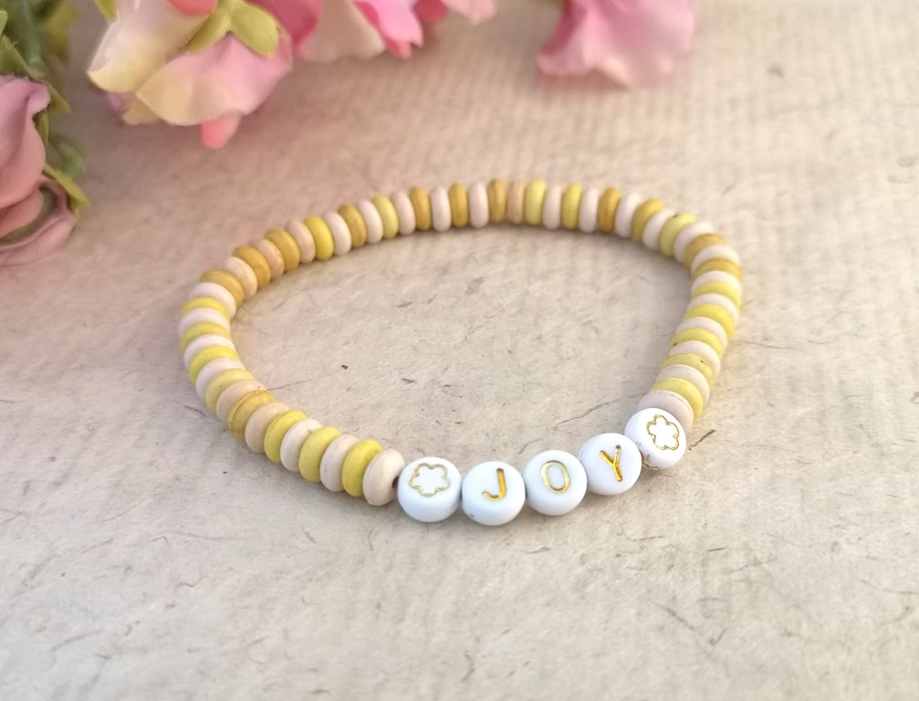 "joy" bracelet with yellow and cream howlite beads