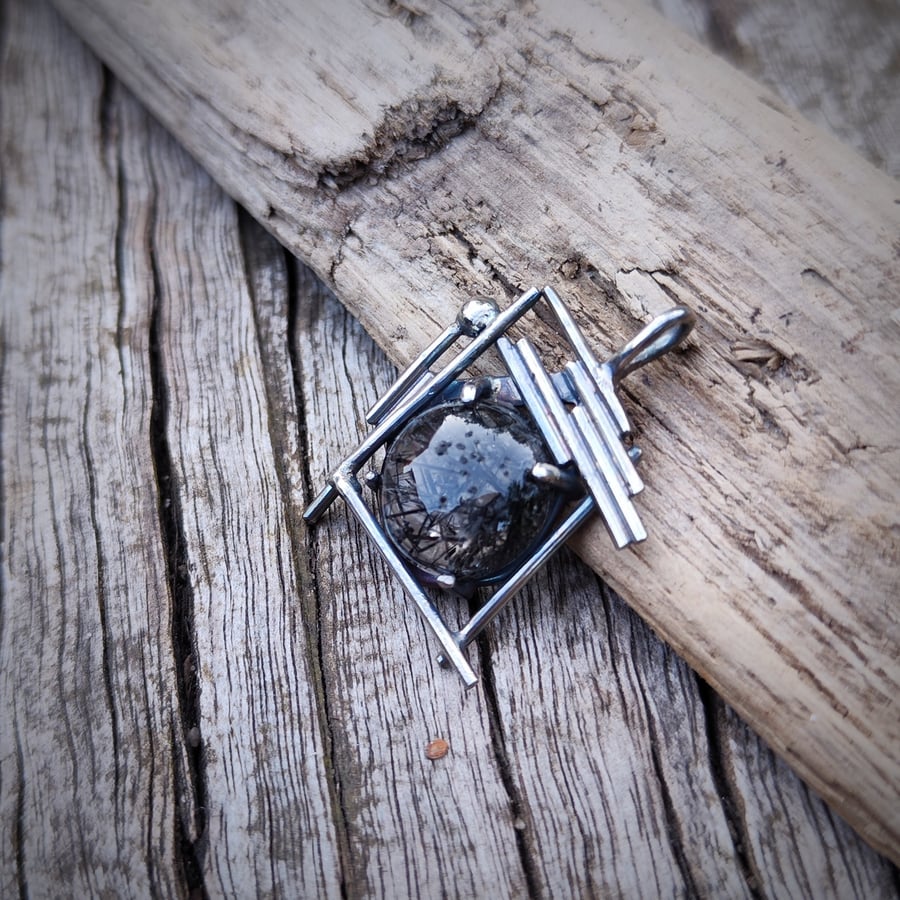 Sterling silver pendant with round rutilated quartz cabochon