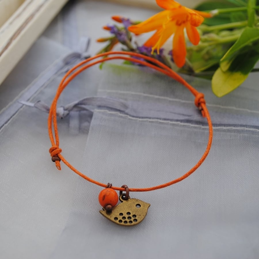 Friendship Bracelet-Orange with copper bird 