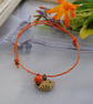 Friendship Bracelet-Orange with copper bird  - Image 1