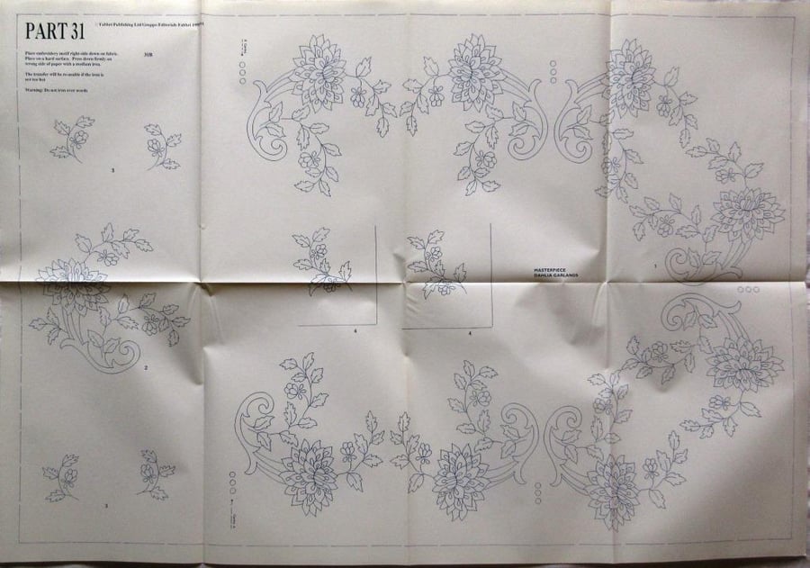 A large embroidery transfer depicting dahlia garlands suitable for a tablecloth 
